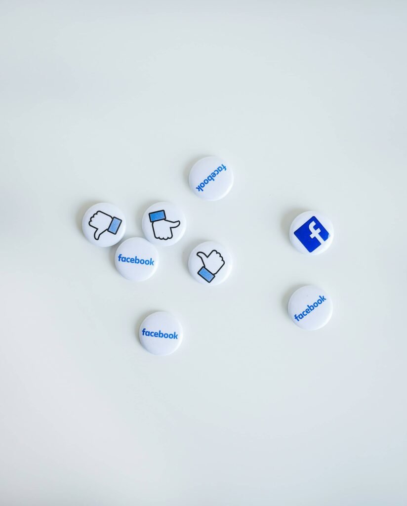 a group of buttons with logos on them